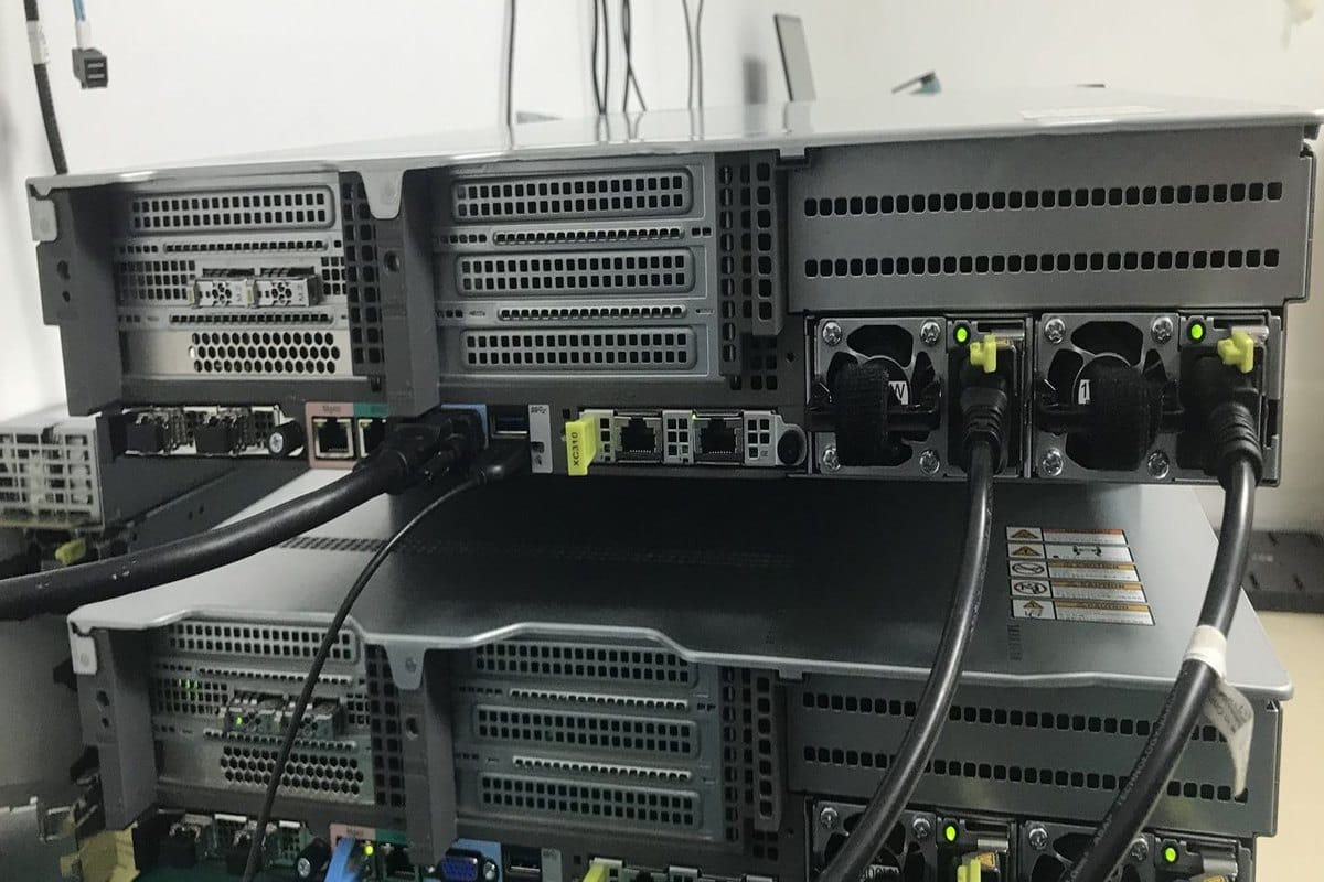 Rear of the xFusion 2288H V7 showing PCIe risers, OCP networking, management and USB ports and redundant 1500 W PSUs