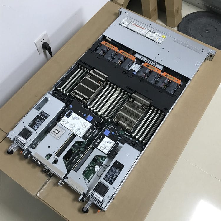 Inside a Dell PowerEdge R660 showing risers, DDR5 memory and cooling shroud, actual unit