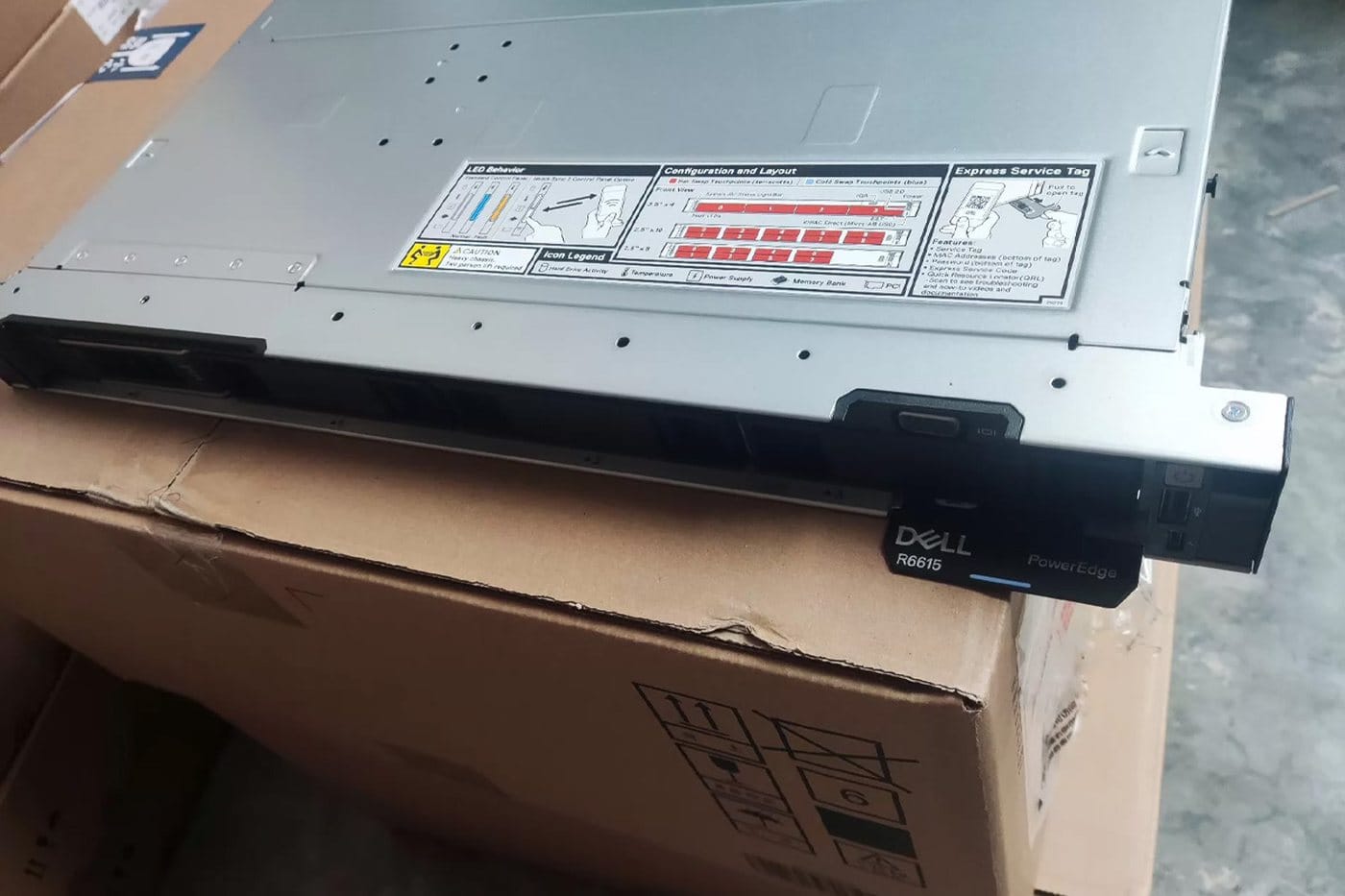Dell PowerEdge R6615 model badge on the front of a server in the warehouse