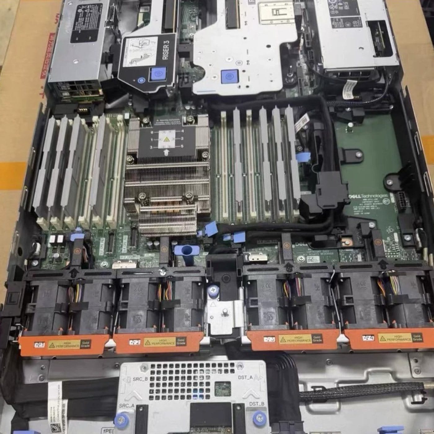Inside a Dell PowerEdge R6615 showing the single EPYC heatsink, DDR5 DIMM slots and riser